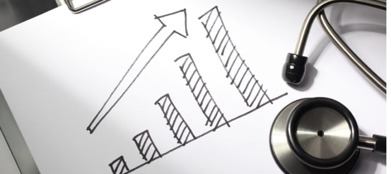 White piece of paper with graph drawn on it with an arrow pointing upwards