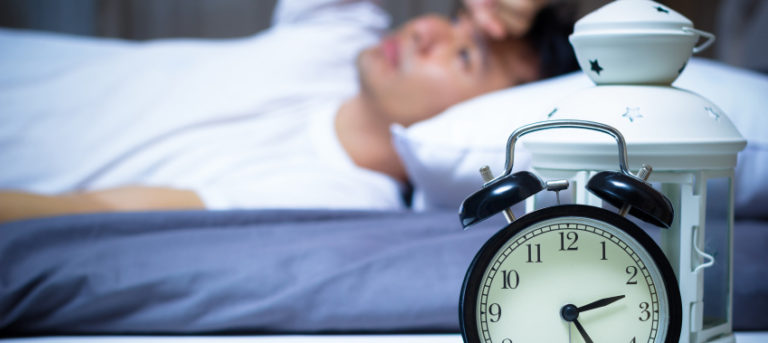 Man laying down in bed