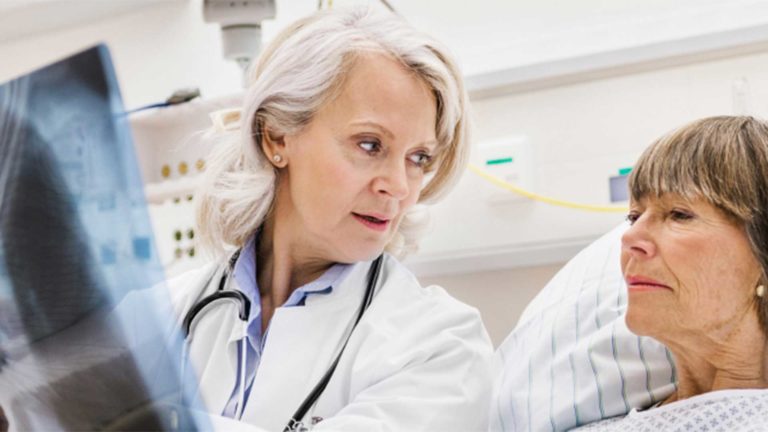 Two woman looking at health information