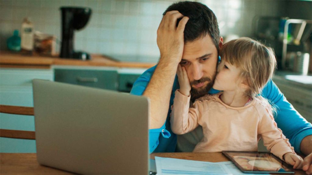 Daughter kissing cheek of father