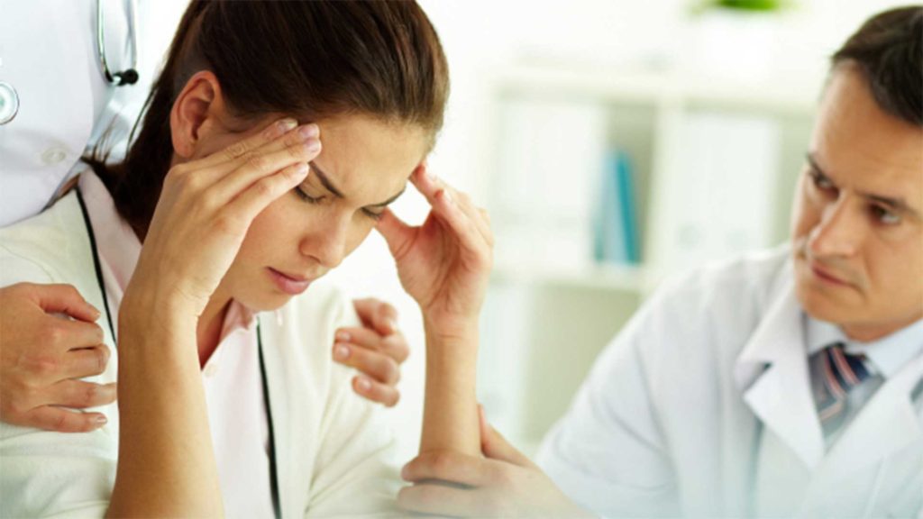 Woman suffering from a headache