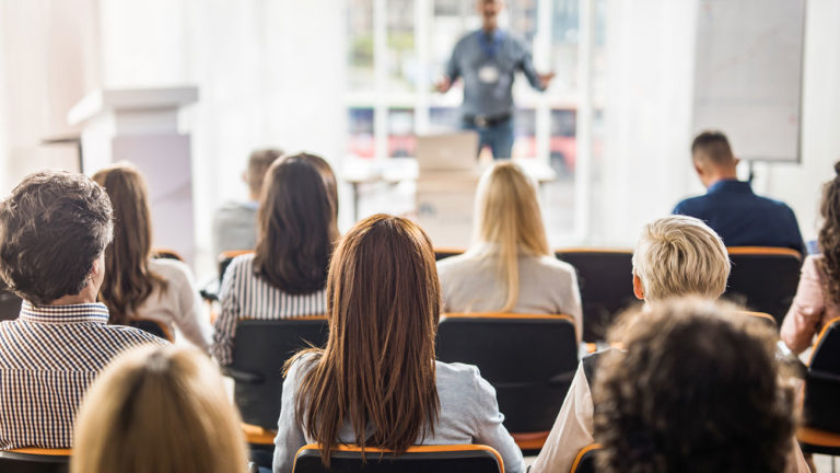 Group of people attending a conference