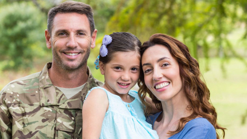 Military family taking a picture together