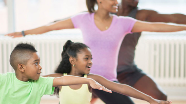 Black family working out together