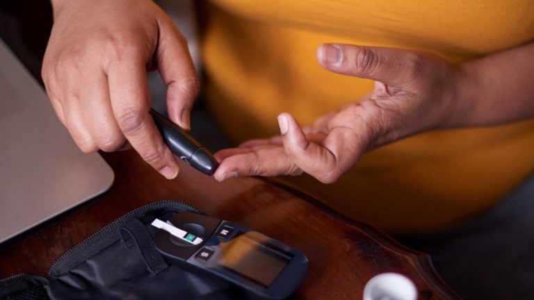 Person taking a diabetes test