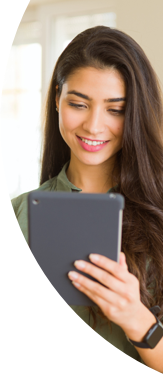woman smiling and holding tablet